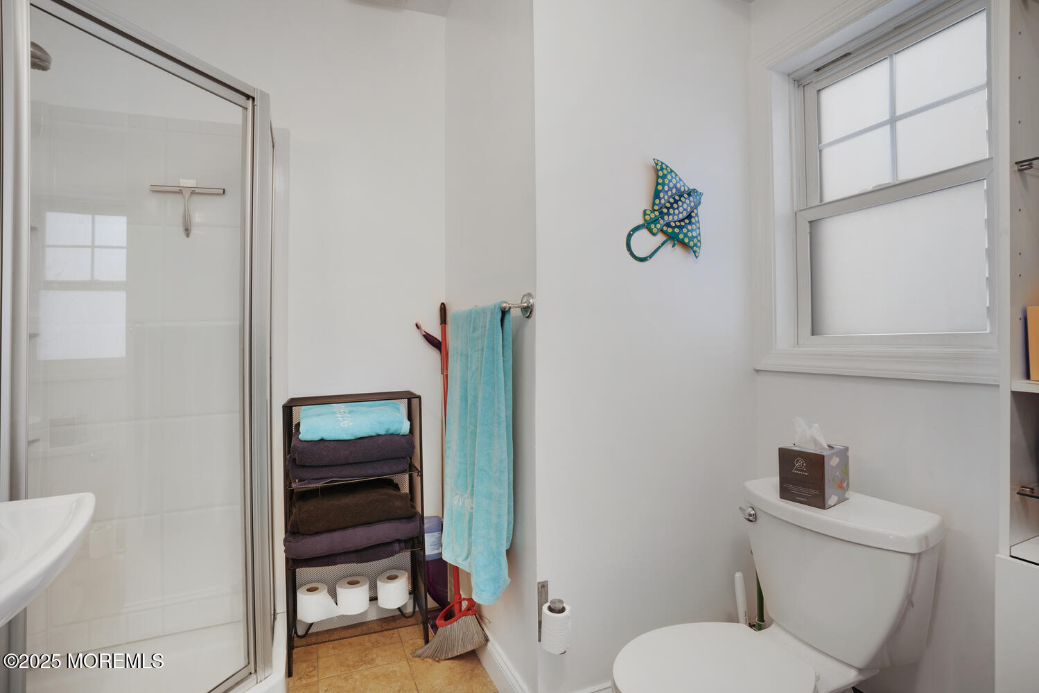 34 West Rutherford Lane Lavallette, NJ 08735 - Photo 19 of 27 a bathroom with a toilet and a shower curtain