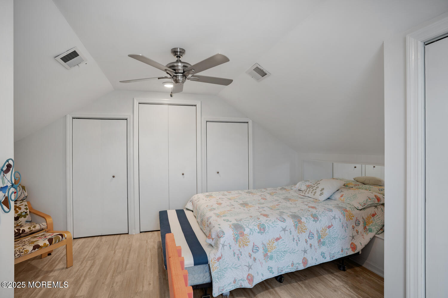34 West Rutherford Lane Lavallette, NJ 08735 - Photo 22 of 27 a bedroom with a bed and a ceiling fan
