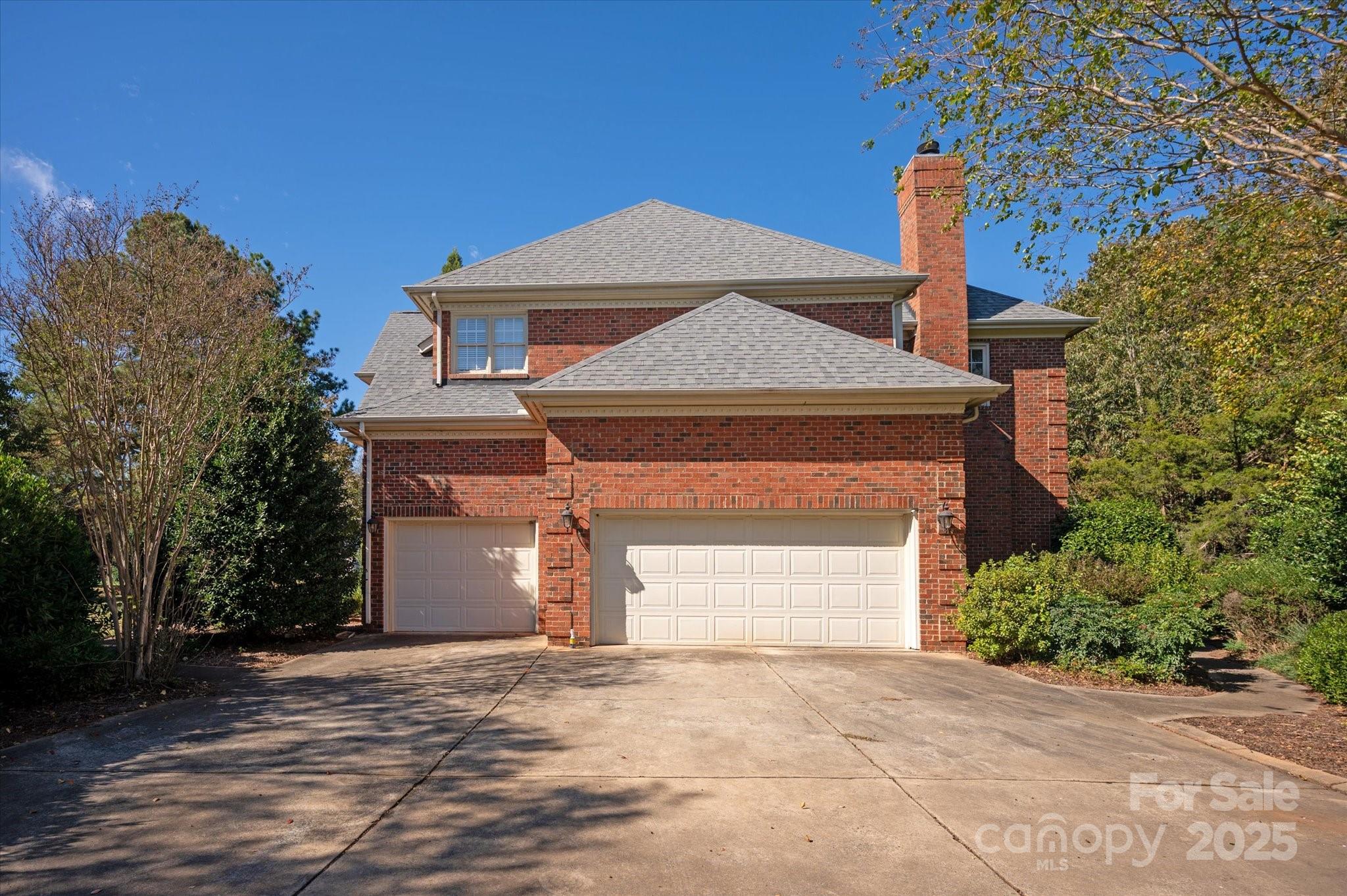 405 Valley Run Road Waxhaw, NC 28173 - Photo 4 of 9 a front view of a house with a yard and garage