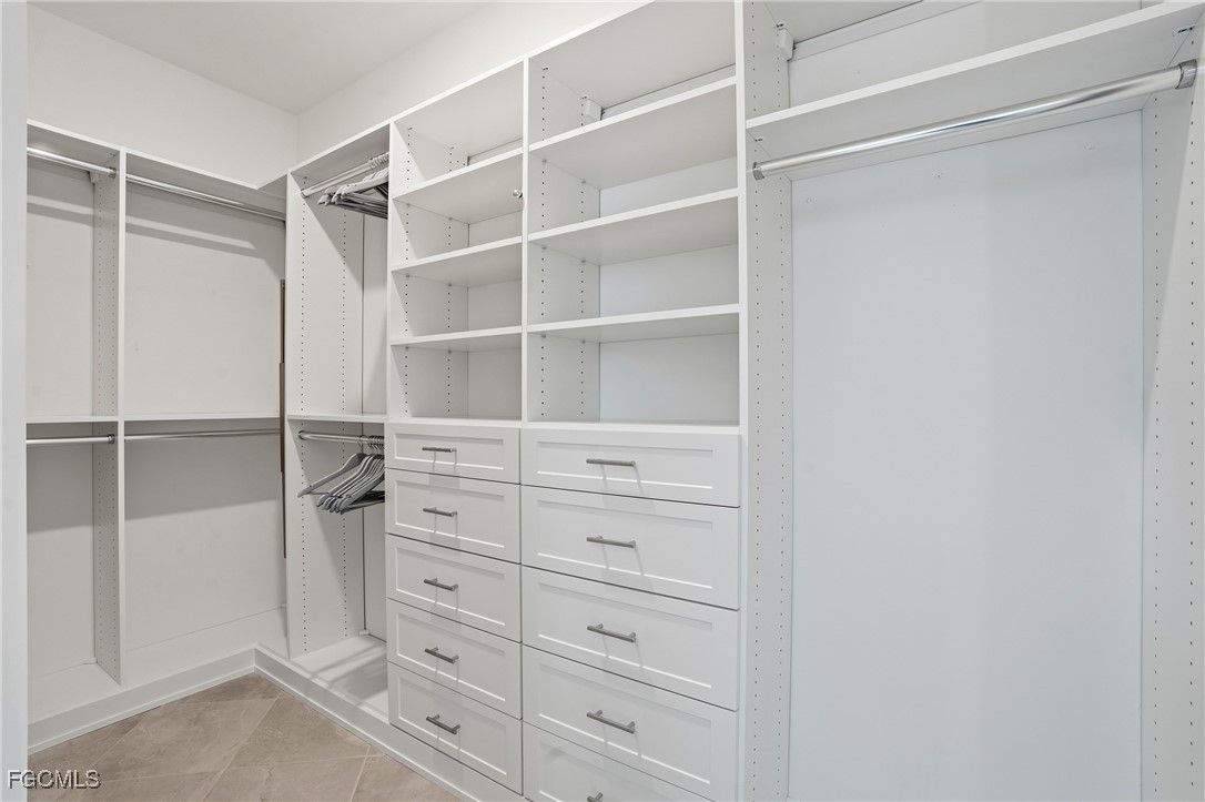 2662 Scarlet Way Naples, FL 34120 - Photo 14 of 47 a view of an empty walk in closet