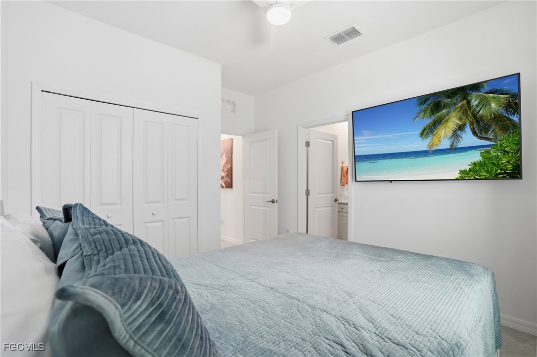 2662 Scarlet Way Naples, FL 34120 - Photo 17 of 47 a view of a bedroom with wooden floor and cabinet