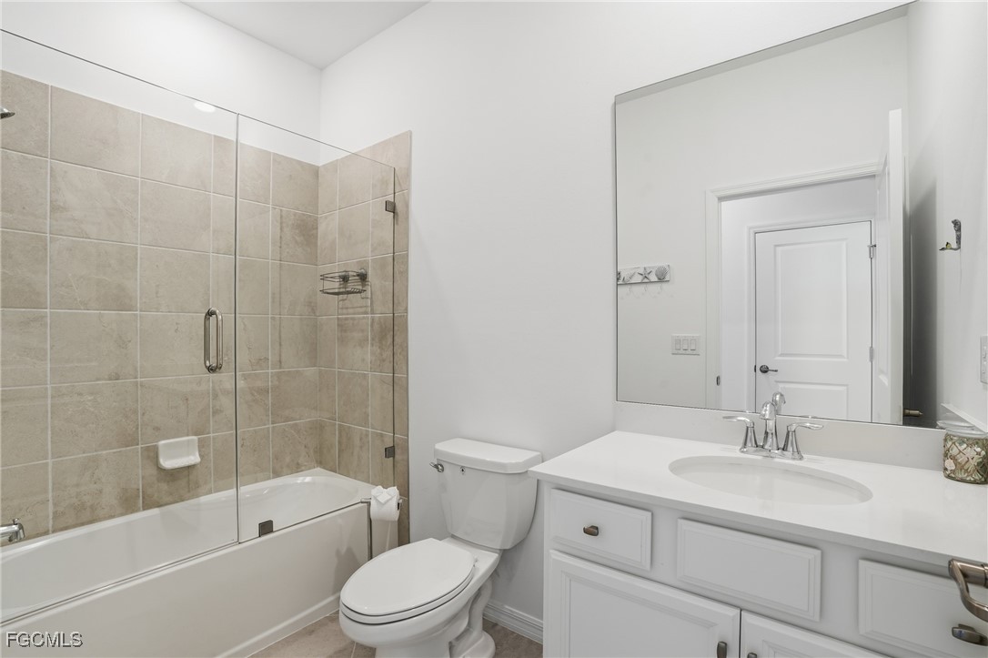 2662 Scarlet Way Naples, FL 34120 - Photo 23 of 47 a bathroom with a sink a toilet and shower