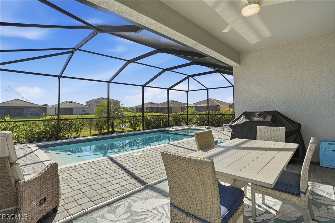 2662 Scarlet Way Naples, FL 34120 - Photo 26 of 47 a view of a patio with swimming pool