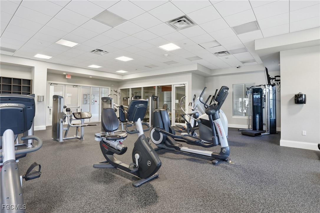 2662 Scarlet Way Naples, FL 34120 - Photo 35 of 47 a view of a room with gym equipment