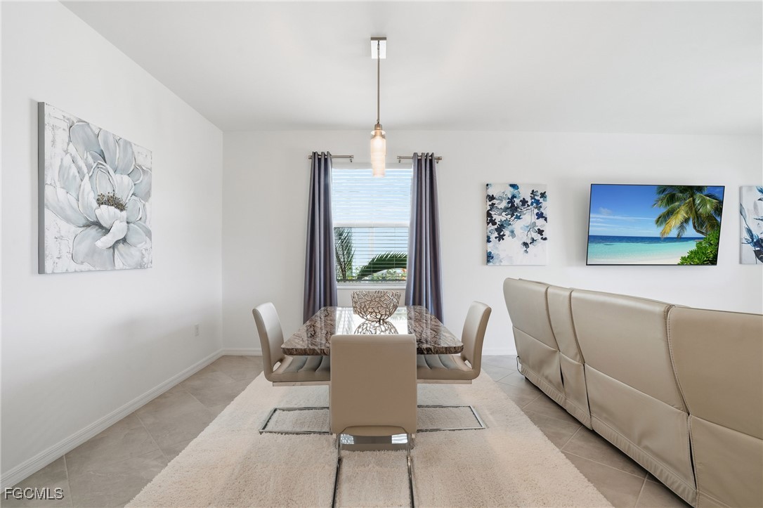 2662 Scarlet Way Naples, FL 34120 - Photo 5 of 47 a living room with furniture and a window