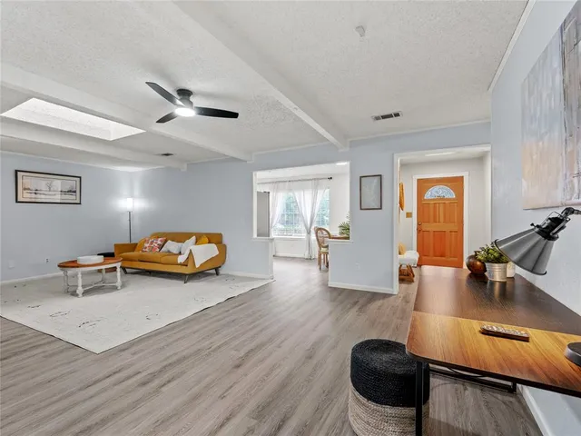 a view of a livingroom with furniture and a table