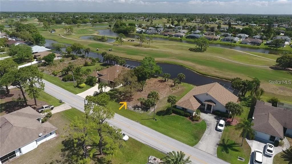 an aerial view of a houses with outdoor space