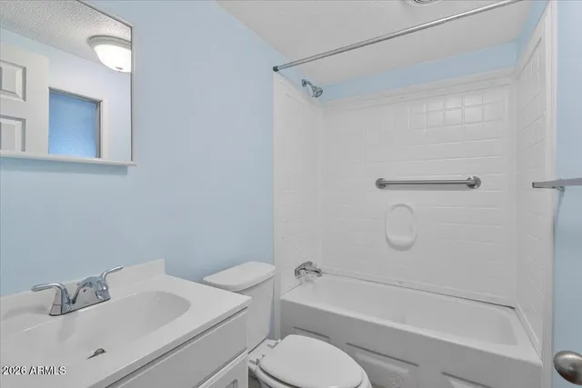 a bathroom with a toilet and a bathtub