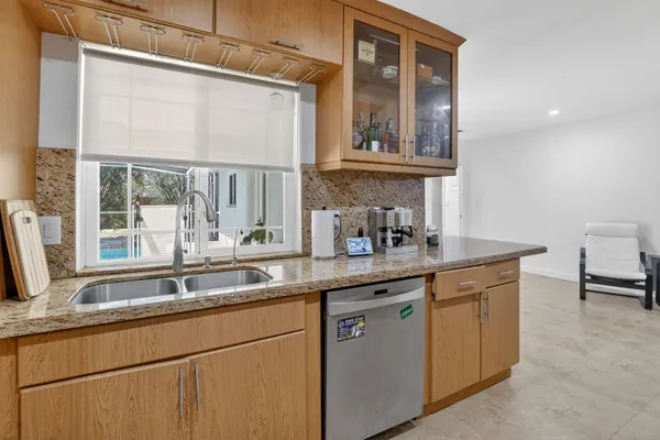 a kitchen with a sink and a window
