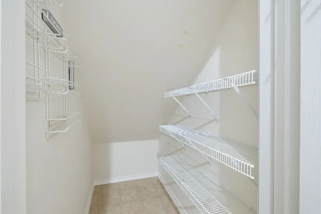 a bathroom with a white toilet and sink