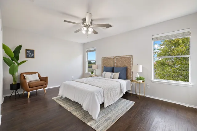 a bedroom with a bed and a chair