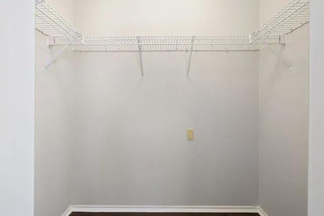 a view of a room with racks on the wall