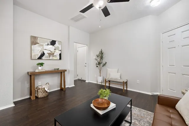 a living room with furniture and a table