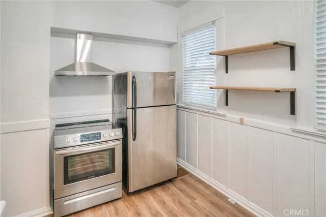 a kitchen that has a lot of windows in it