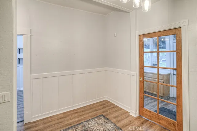 a white toilet sitting next to a bath tub