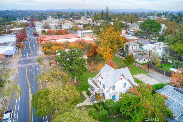 an aerial view of residential houses with outdoor space