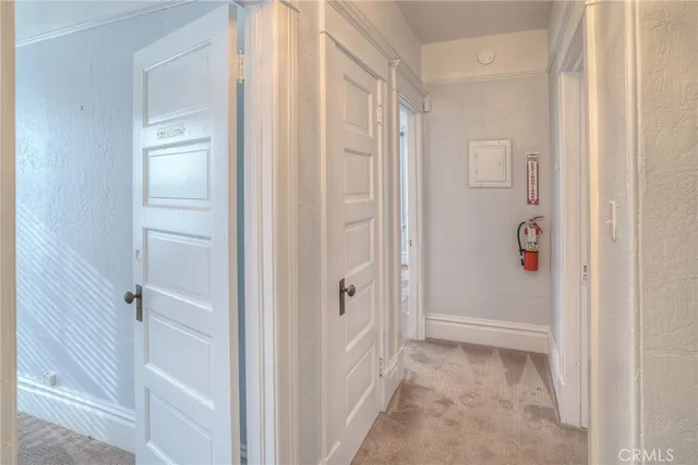 an aerial view of residential houses with outdoor space and lake view