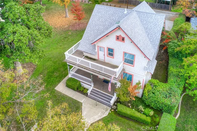 a view of house with backyard