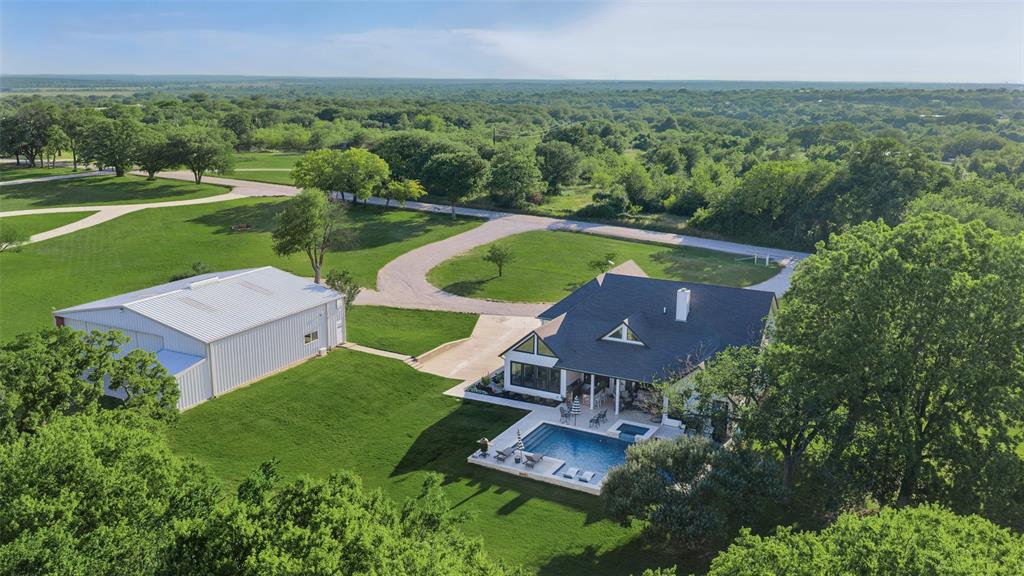 492 County Road 4387 Decatur, TX 76234 - Photo 34 of 40 an aerial view of a house with garden space and street view