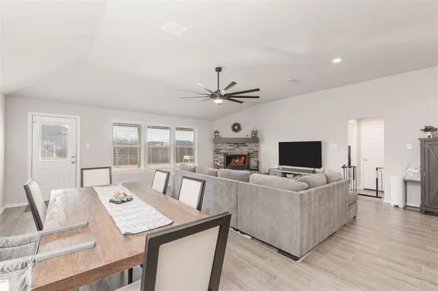 a view of a livingroom with furniture window and wooden floor
