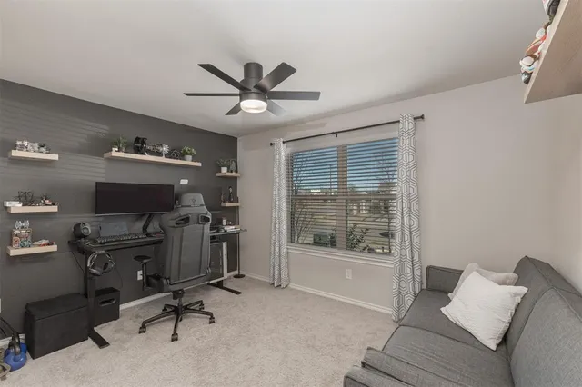 a view of workspace with furniture and windows