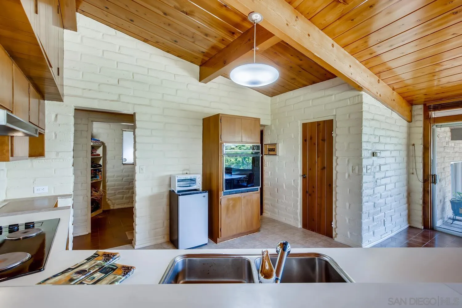 14565 High Valley Road Poway, CA 92064 - Photo 11 of 28 a bathroom with a sink a mirror and shower