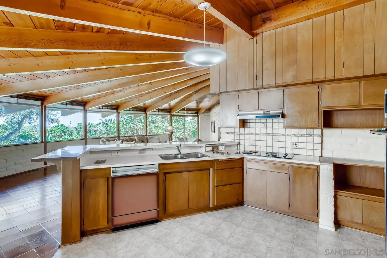 14565 High Valley Road Poway, CA 92064 - Photo 12 of 28 a kitchen with a sink and cabinets