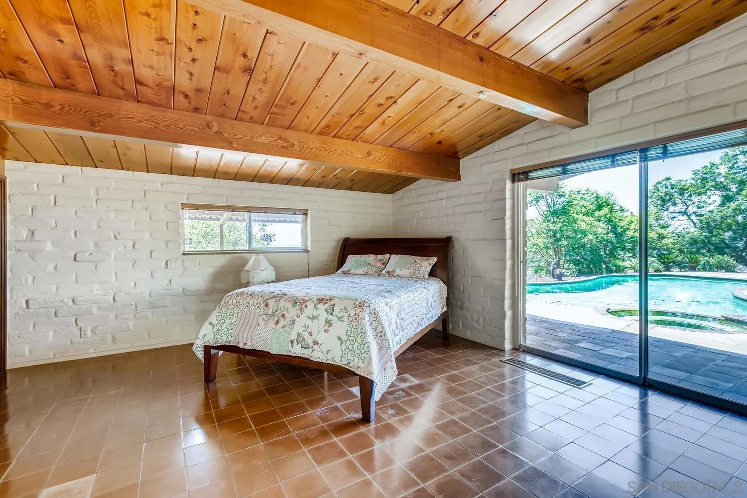 14565 High Valley Road Poway, CA 92064 - Photo 13 of 28 a spacious bedroom with a bed and wooden floor