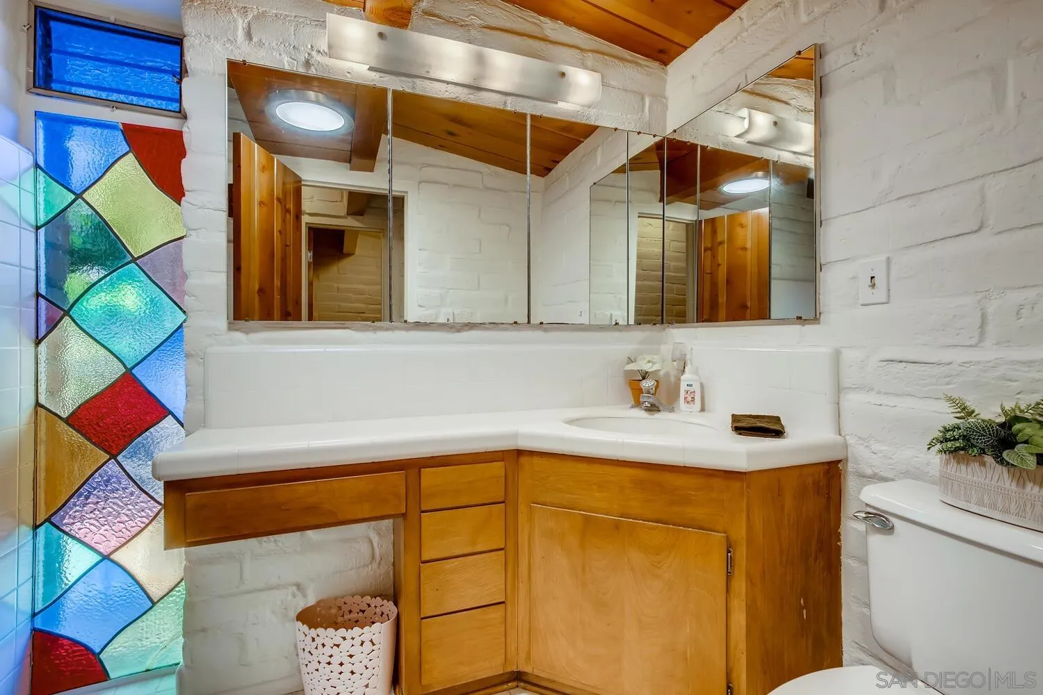 14565 High Valley Road Poway, CA 92064 - Photo 16 of 28 a bathroom with a sink and a mirror