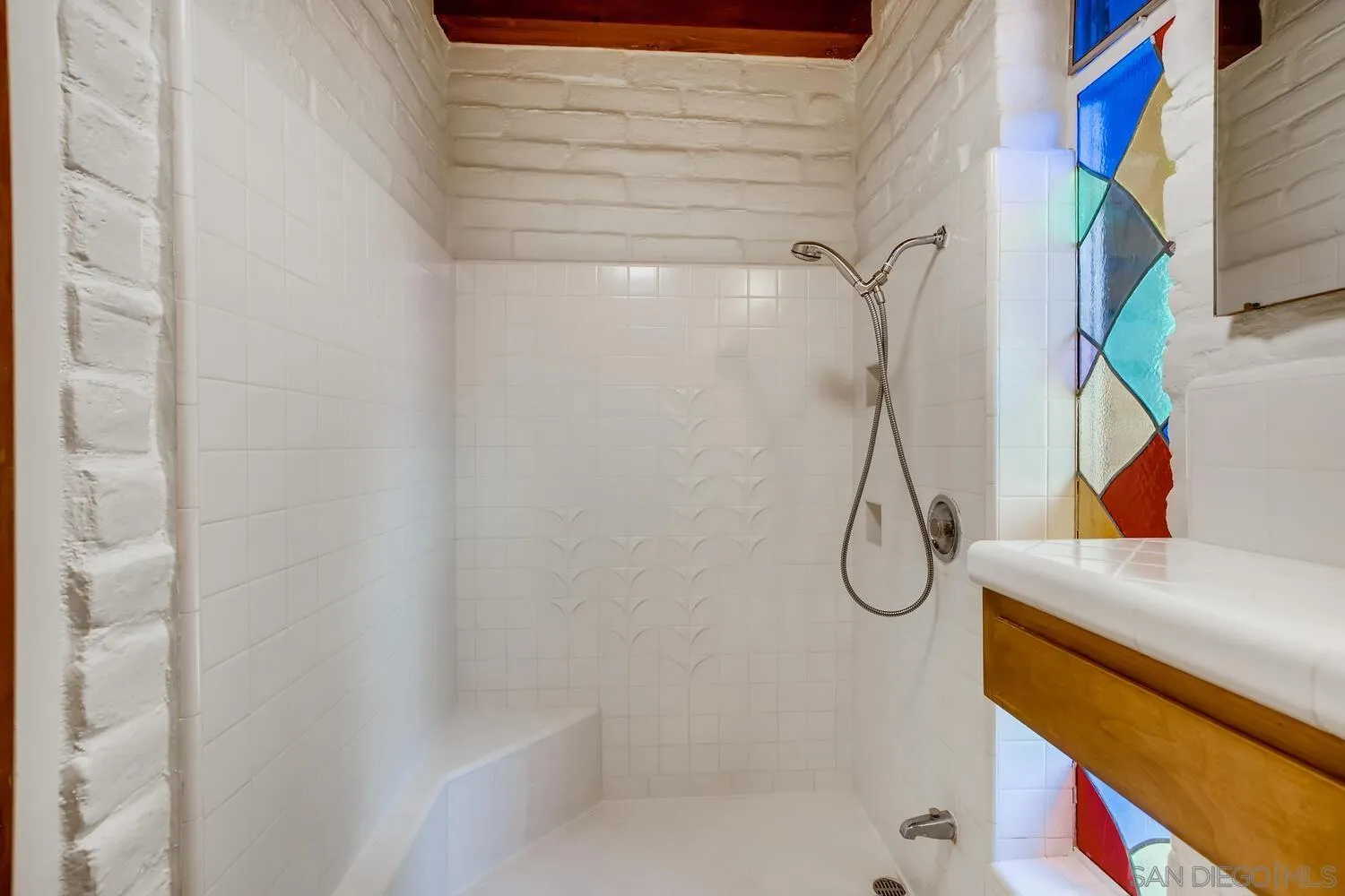 14565 High Valley Road Poway, CA 92064 - Photo 17 of 28 a bathroom with a glass shower door