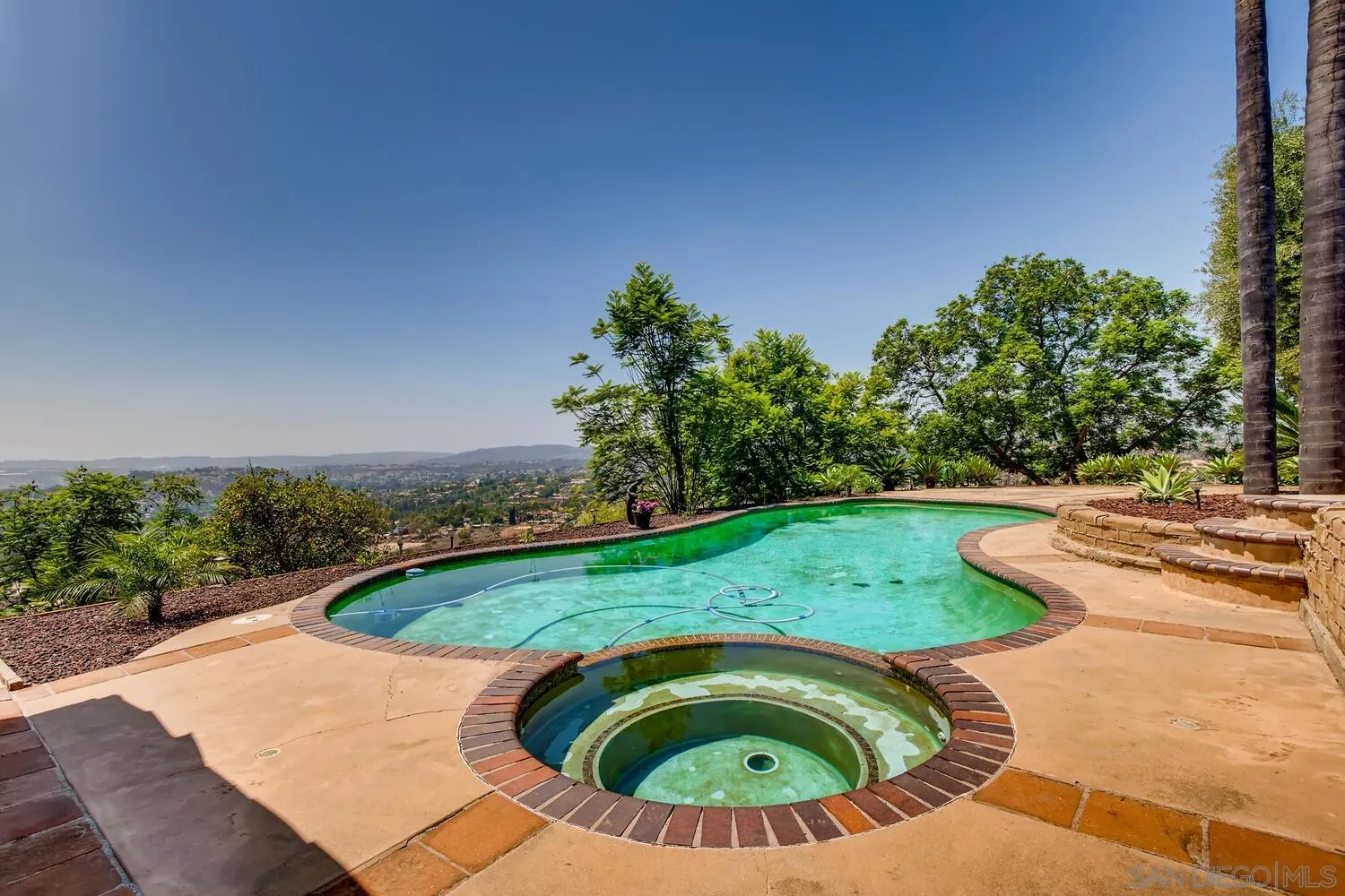 14565 High Valley Road Poway, CA 92064 - Photo 26 of 28 a view of a swimming pool with a yard