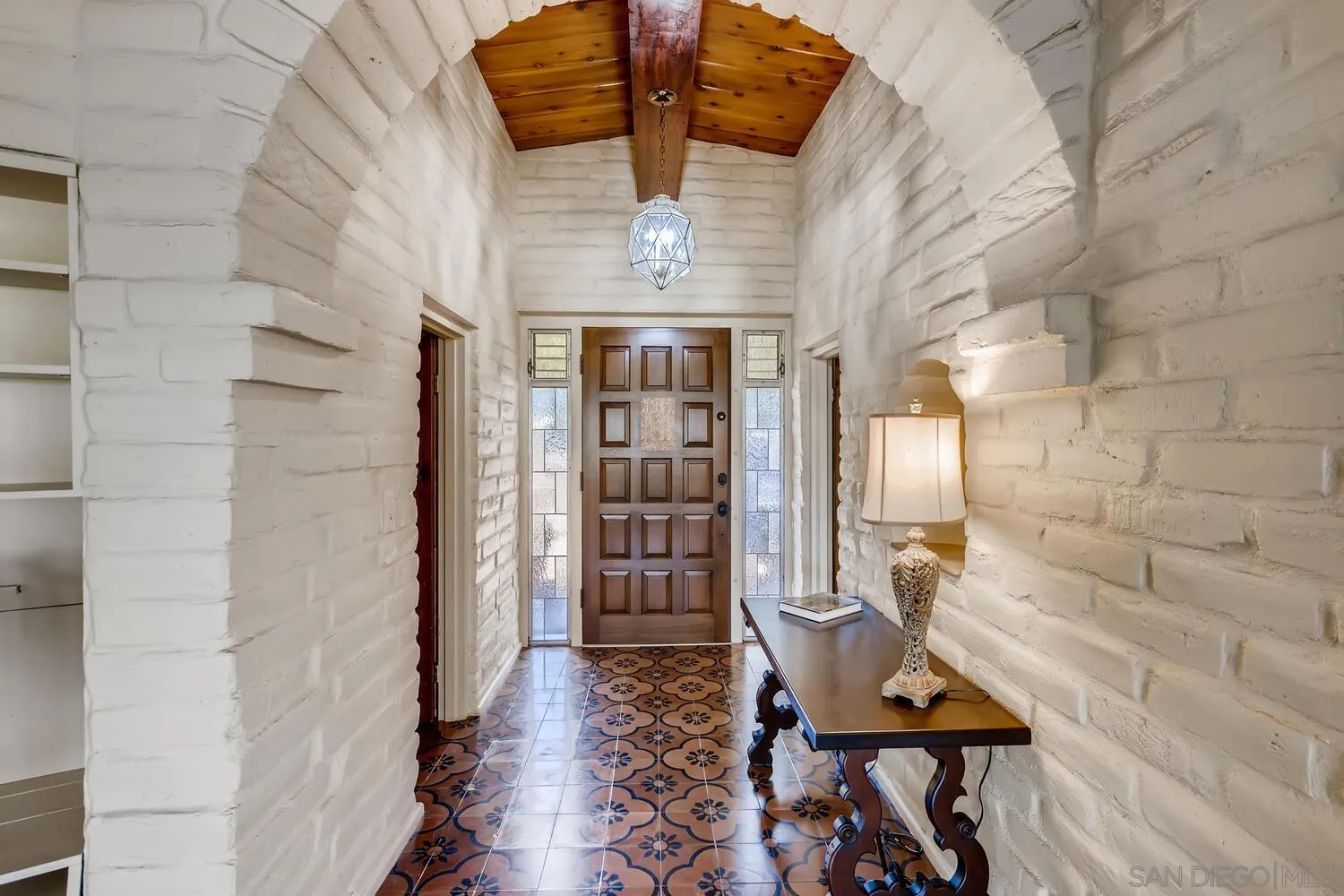 14565 High Valley Road Poway, CA 92064 - Photo 3 of 28 a view of a hallway with wooden floor and staircase