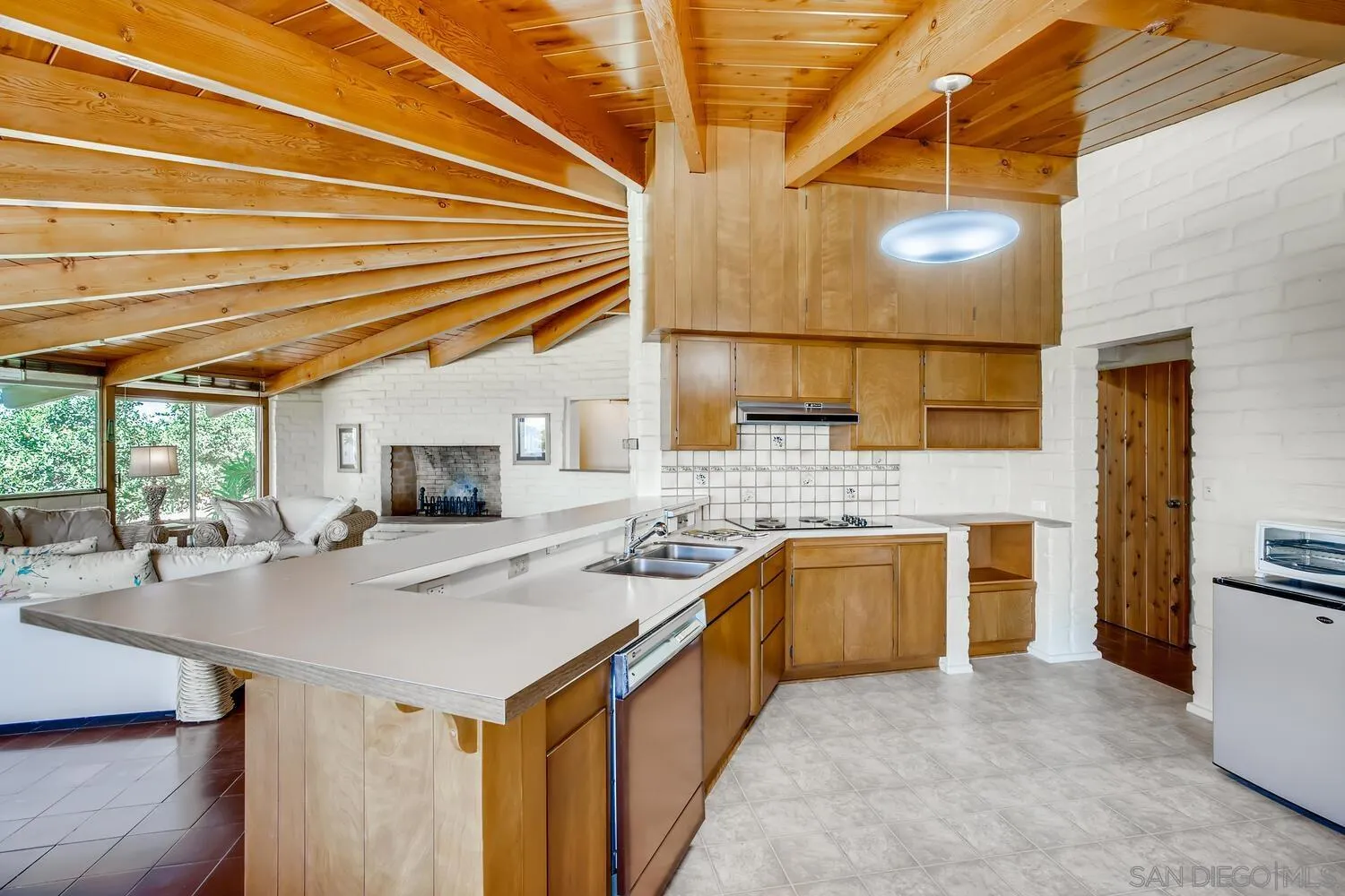 14565 High Valley Road Poway, CA 92064 - Photo 8 of 28 a kitchen with stainless steel appliances granite countertop a sink and cabinets