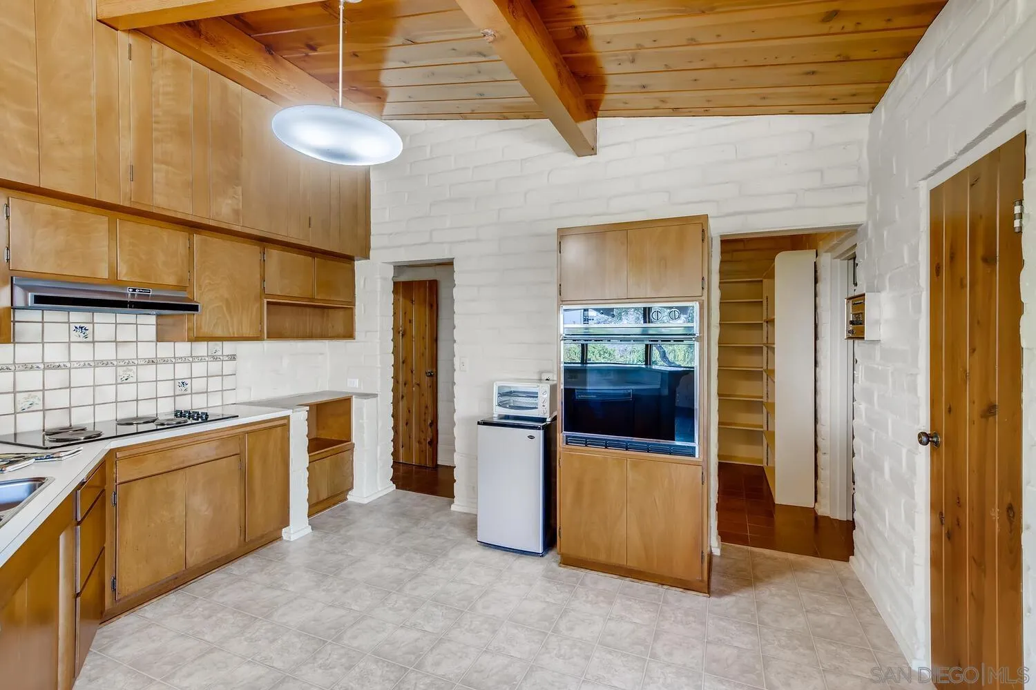14565 High Valley Road Poway, CA 92064 - Photo 9 of 28 a kitchen with stainless steel appliances granite countertop a stove a sink and a refrigerator