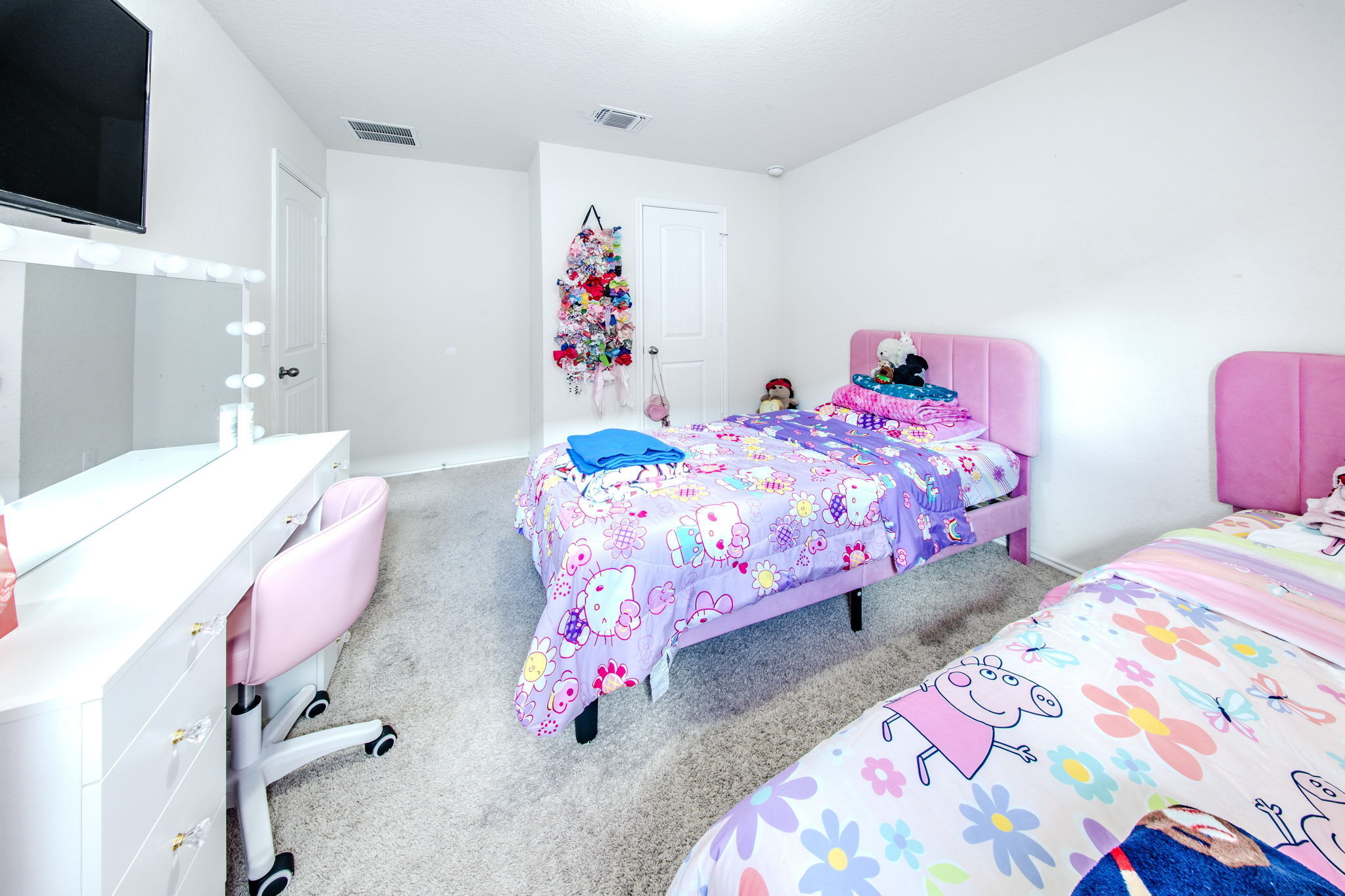 14903 Tuff Road Manor, TX 78653 - Photo 14 of 25 A well-lit bedroom provides ample space and a neutral canvas for personalization.