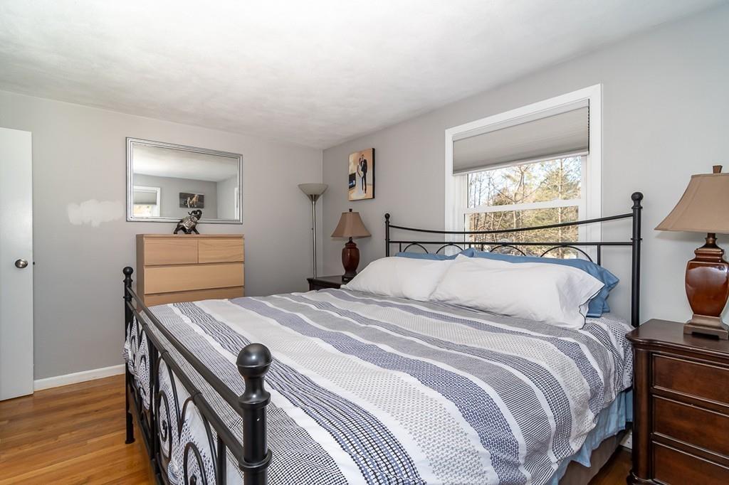 15 Richard Road Hudson, MA 01749 - Photo 10 of 22 a bedroom with a bed and wooden floor