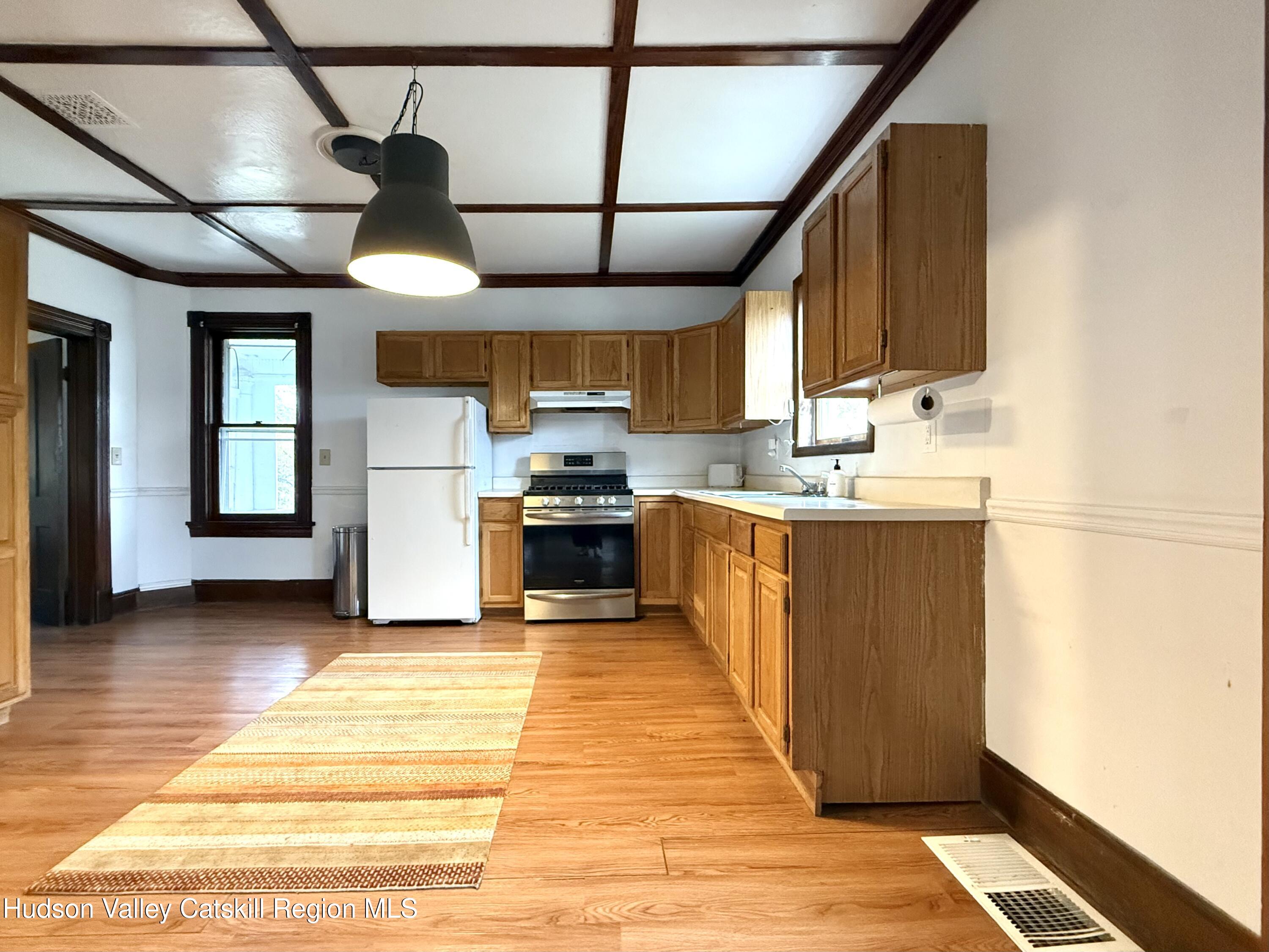 5 Clum Hill Road Haines Falls, NY 12436 - Photo 6 of 14 a kitchen with stainless steel appliances kitchen island granite countertop a sink and cabinets