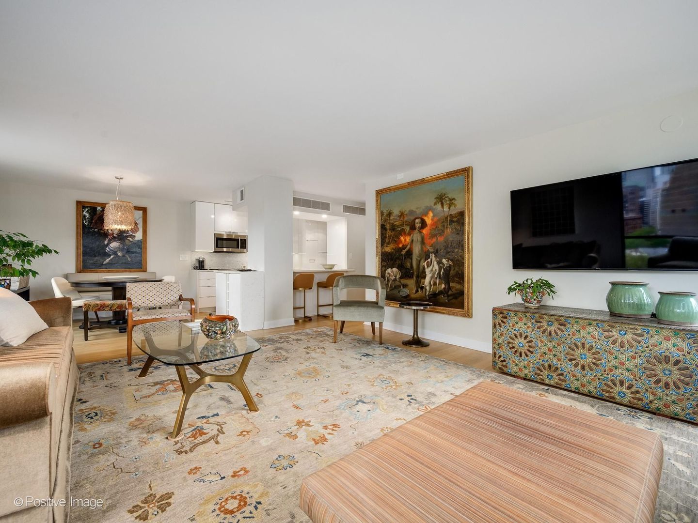 1310 North Ritchie Court, Unit 11C Chicago, IL 60610 - Photo 8 of 27 a living room with furniture and a flat screen tv