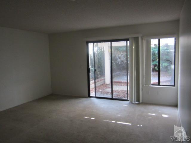 237 Village Road Port Hueneme, CA 93041 - Photo 16 of 30 an empty room with windows and city view