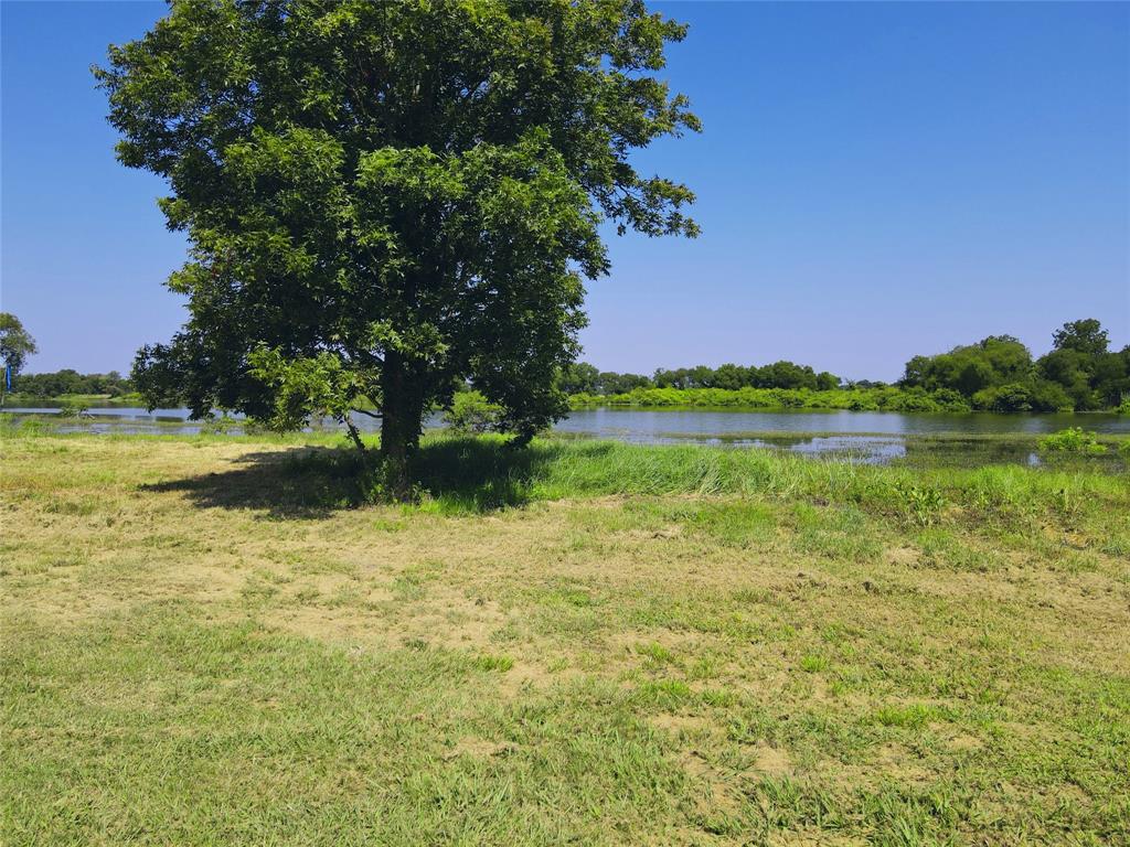 5086 Waterfront Road Kerens, TX 75144 - Photo 11 of 30 a view of a lake with a house in the background