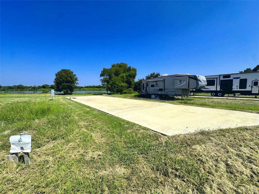 5086 Waterfront Road Kerens, TX 75144 - Photo 12 of 30 a view of a swimming pool and a yard
