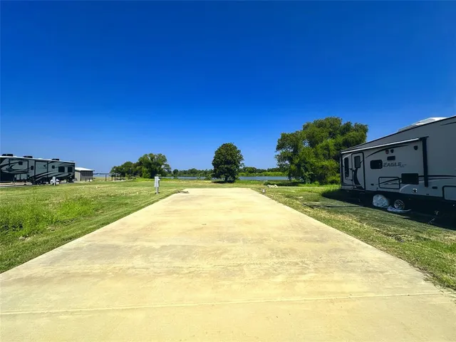 a view of a house with a yard and a garden