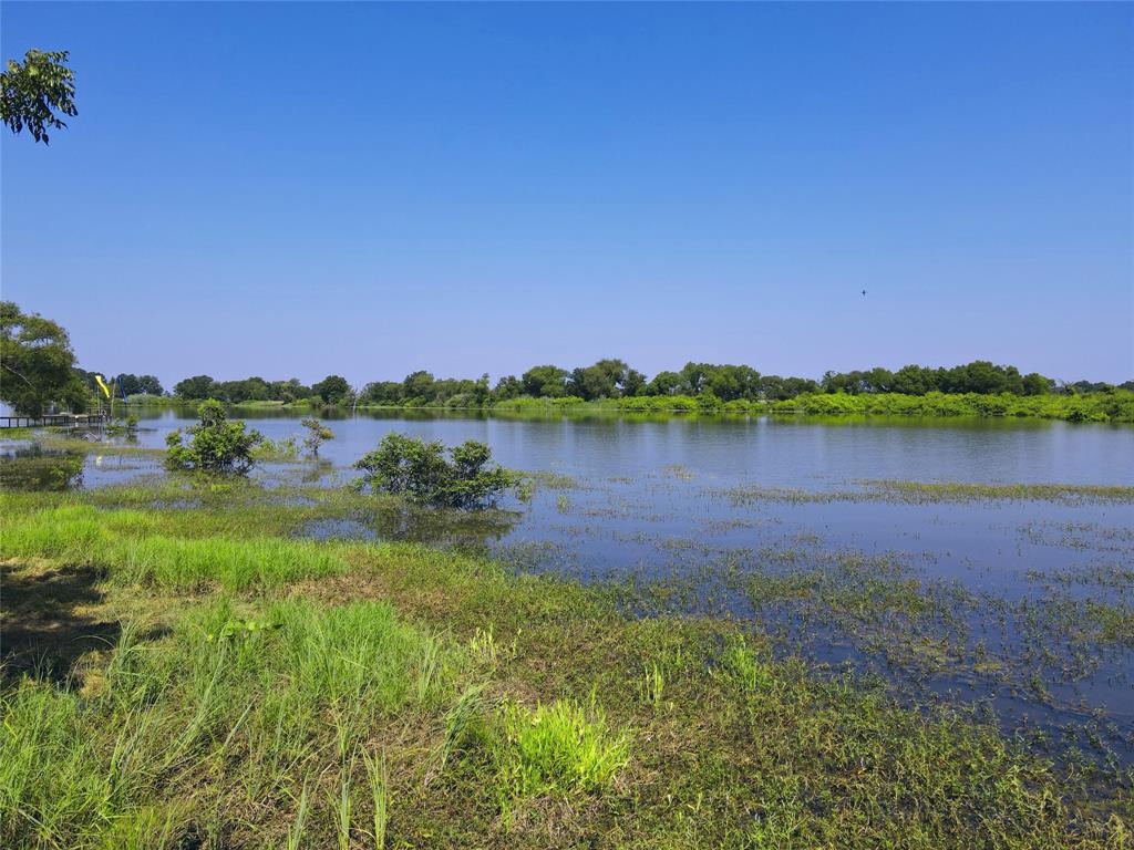 5086 Waterfront Road Kerens, TX 75144 - Photo 7 of 30 a view of a lake with houses in the background