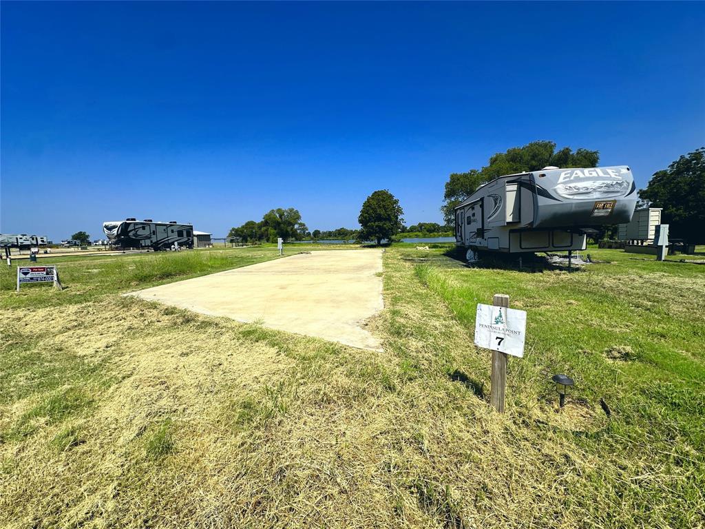 5086 Waterfront Road Kerens, TX 75144 - Photo 8 of 30 a view of a house with a yard