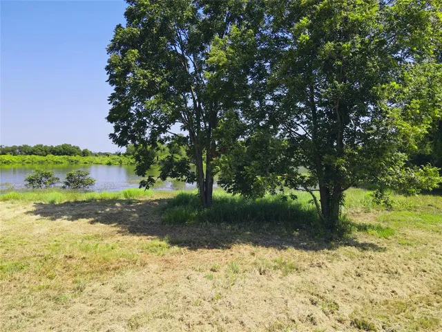 a view of a lake with a house in the background