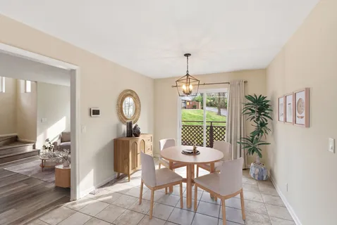 a view of a dining room with furniture window and outside view