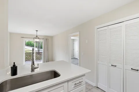 a kitchen with a sink and a window