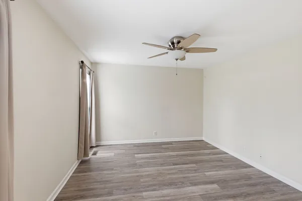 a view of a big room with wooden floor and closet