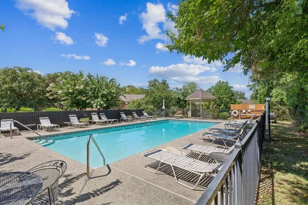 a view of a swimming pool with lounge chair