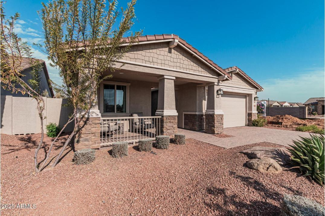 17386 West Bloomfield Road Surprise, AZ 85388 - Photo 2 of 31 a view of a house with backyard and sitting area